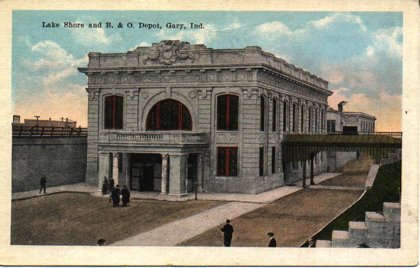 Historic postcard depicting the Lake Shore and B. & O. Depot in Gary, Indiana, featuring a grand architectural design with red windows and a wide entrance.